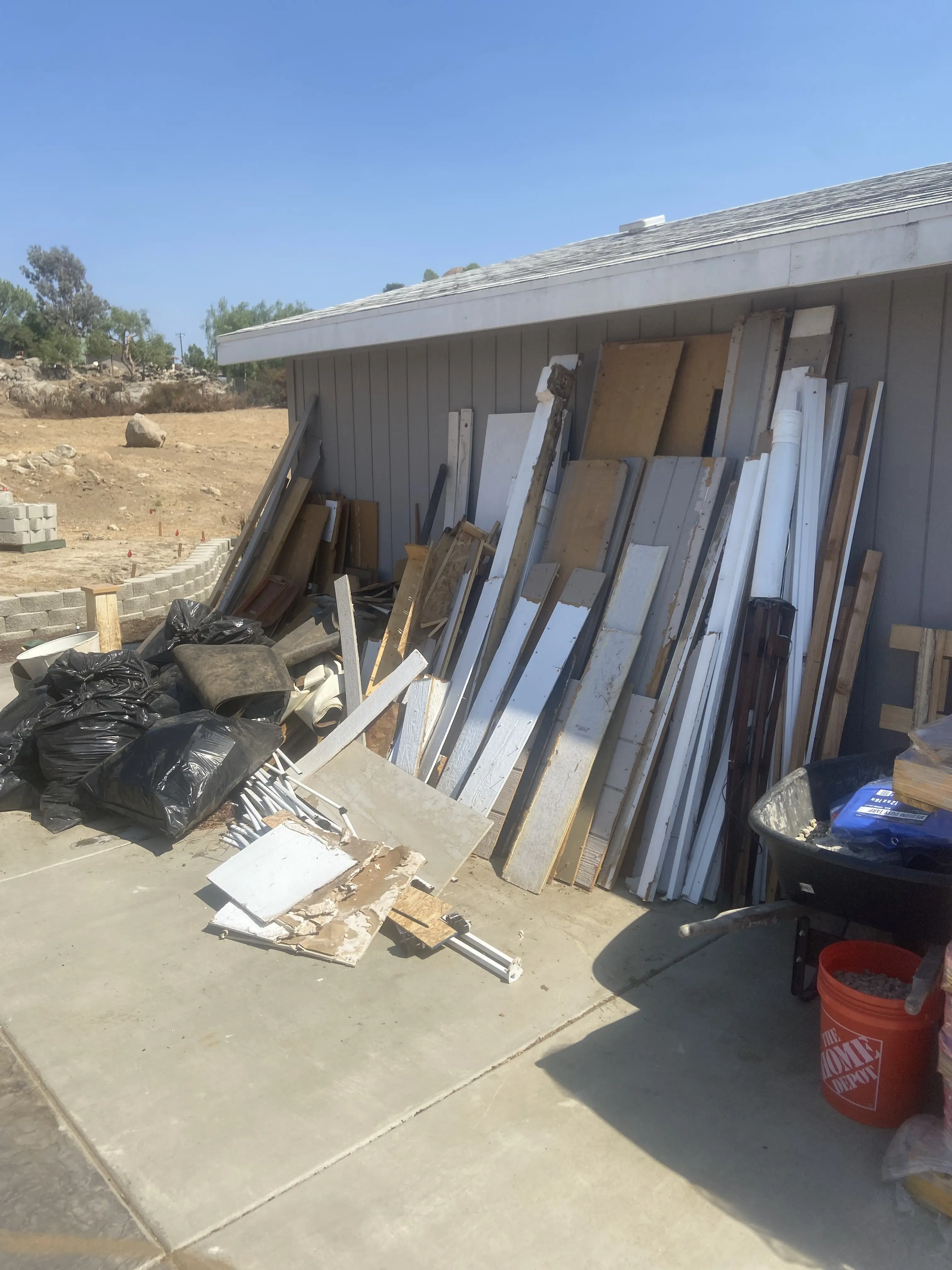 Before: Cluttered backyard cleared